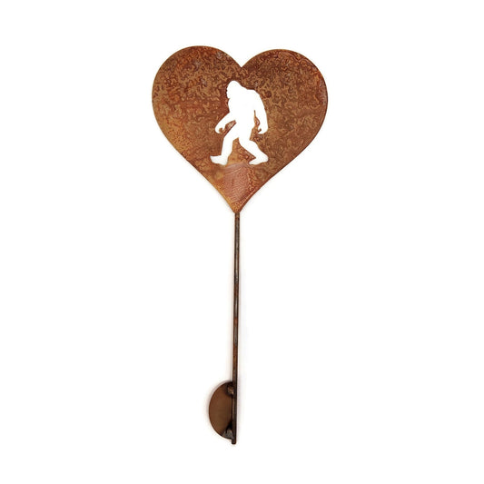 Heart-shaped sasquatch metal garden stake in rust
