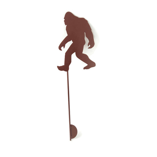 Walking sasquatch-shaped metal garden stake in brown powder coat