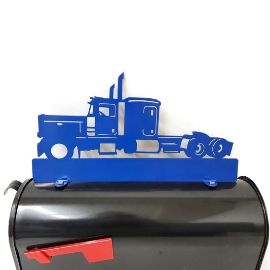 Blue semi truck custom mailbox topper installed on a mailbox