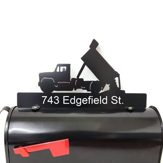 Black dump truck custom mailbox topper with address installed on a mailbox.