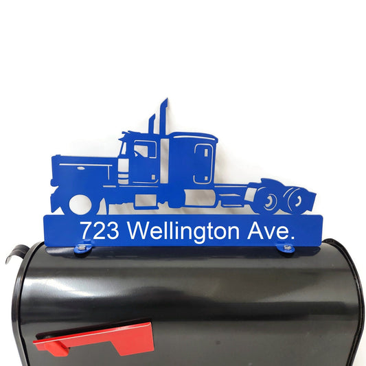 Blue semi truck custom mailbox topper with address installed on a mailbox