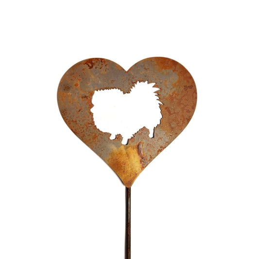 Heart-shaped rusty garden stake sign in rust with a pomeranian dog silhouette