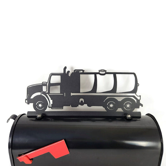 Black pump truck mailbox topper installed on a mailbox
