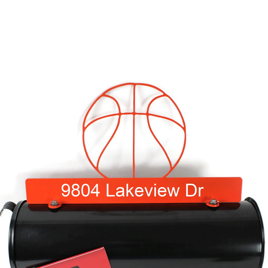 Orange custom basketball mailbox topper with address installed on a mailbox.