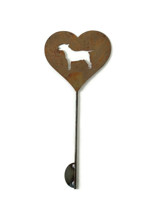 Heart-shaped rusty garden stake sign in rust with an english bull terrier dog silhouette
