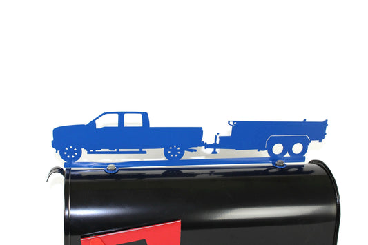 Blue pickup and dump trailer mailbox topper installed on a mailbox