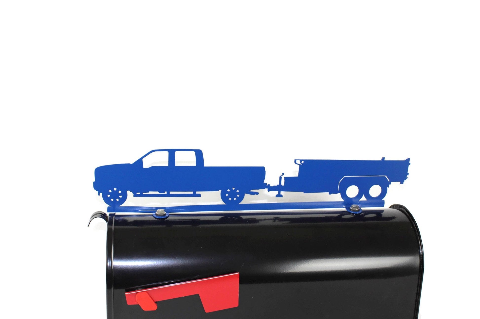 Blue pickup and dump trailer mailbox topper installed on a mailbox