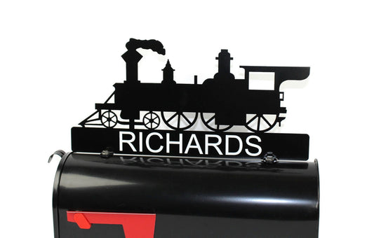 Black train engine custom mailbox topper with address installed on a mailbox