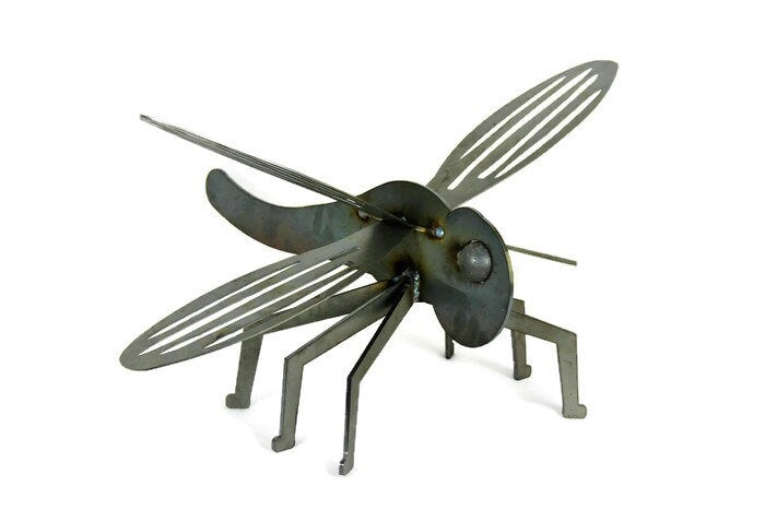 Giant metal dragonfly garden statue in raw steel