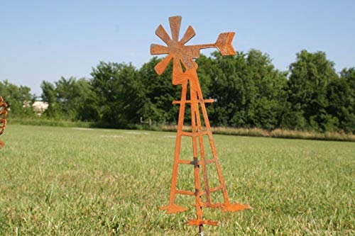 Rusty metal windmill garden stake
