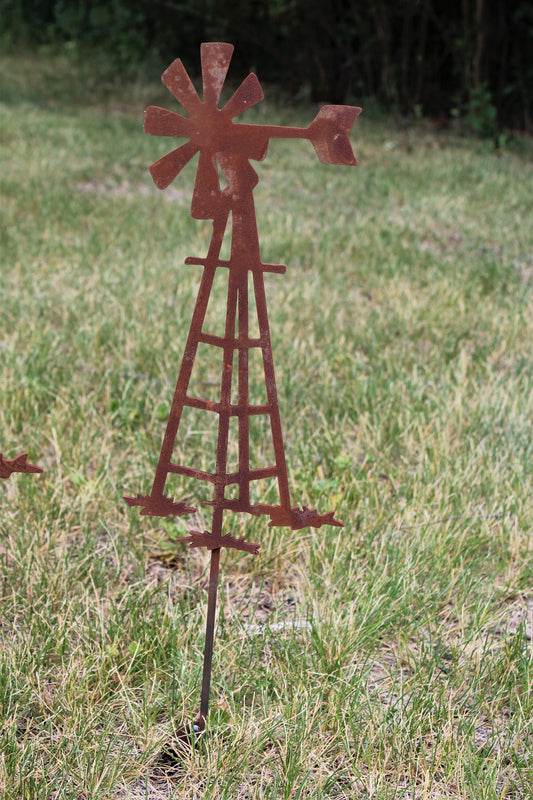 Rusty metal windmill garden stake