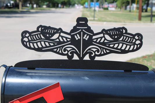 Black powder coat US Navy surface warfare service pin metal mailbox topper installed on a mailbox
