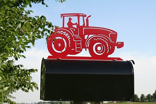 Red modern tractor mailbox topper installed on a mailbox