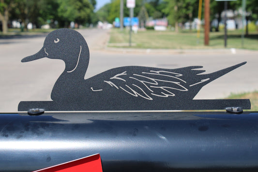 Black mallard duck mailbox topper installed on a mailbox