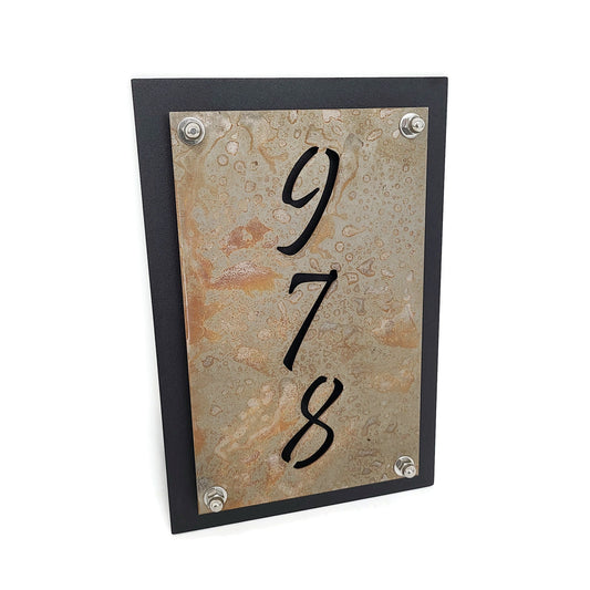 Rust over black vertical layered metal address sign
