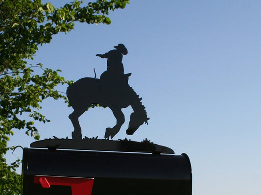 Black bucking rodeo bronco mailbox topper installed on a mailbox