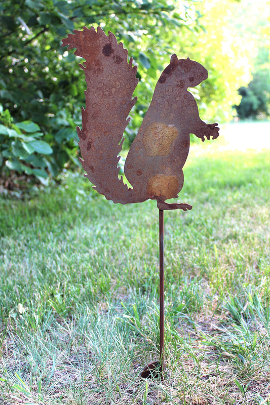 Squirrel shaped metal garden stake in rust