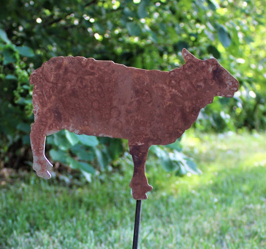 Rusty sheep shaped metal garden stake