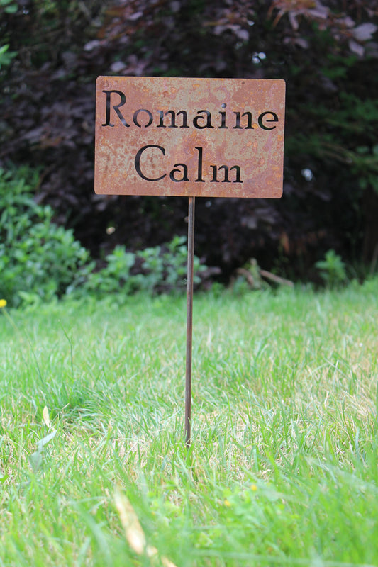 Romaine Calm rusty garden stake sign
