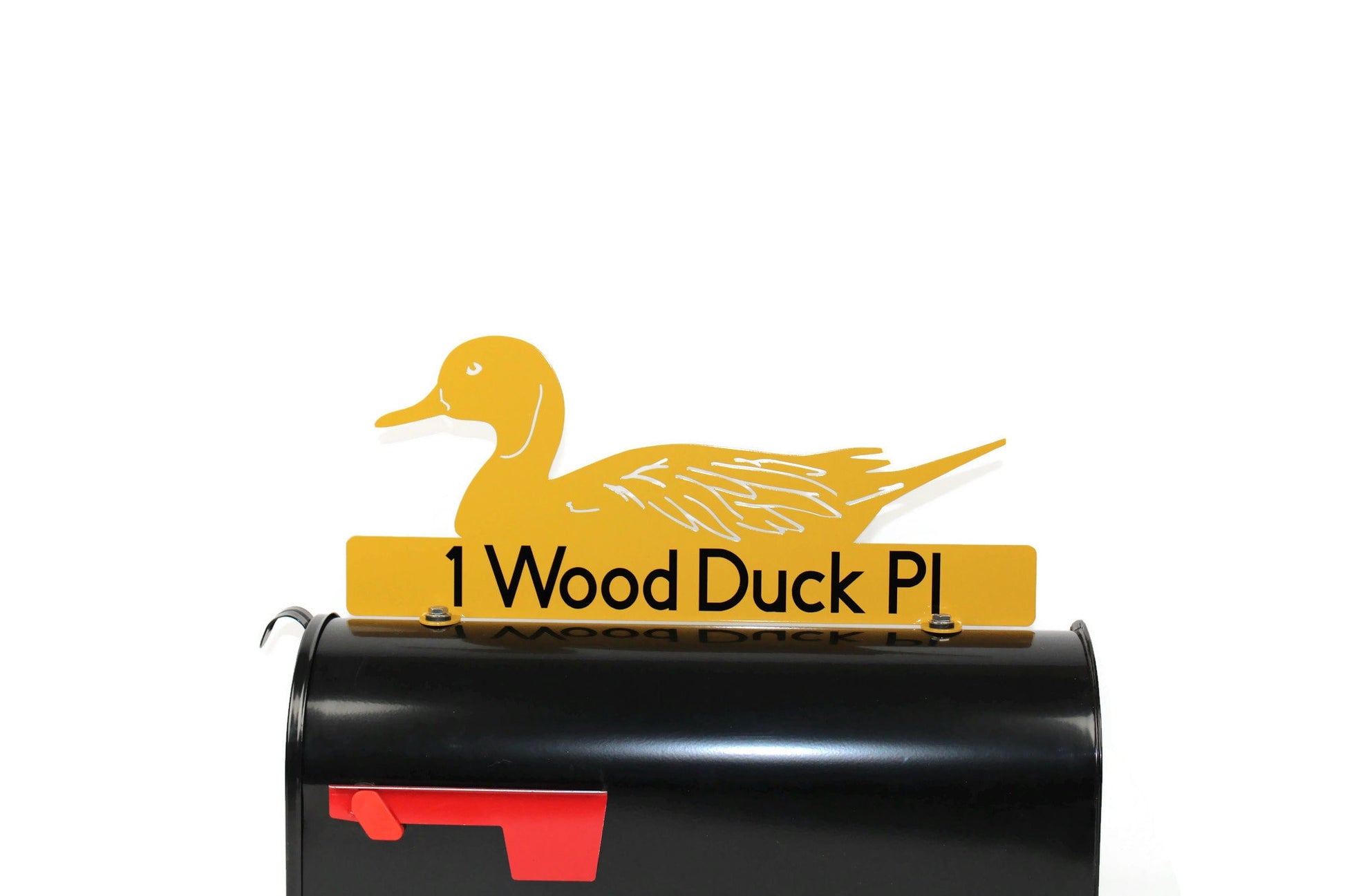 Dark yellow mallard duck custom mailbox topper with address installed on a mailbox