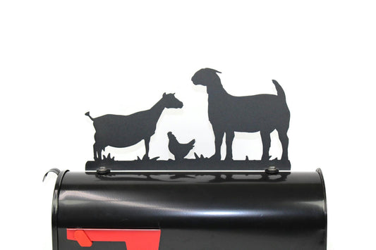 Black goats and hen mailbox topper installed on a mailbox