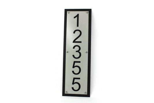 Light gray over black vertical layered metal address sign