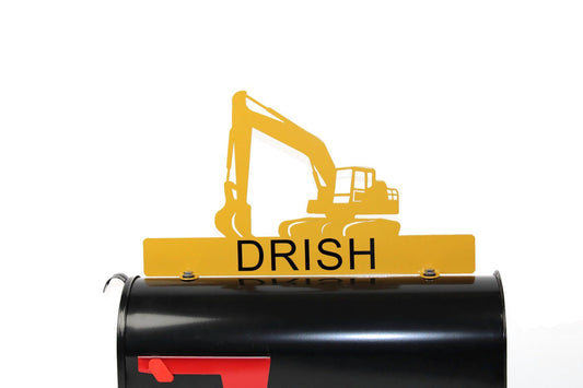 Yellow excavator custom mailbox topper with name installed on a mailbox.