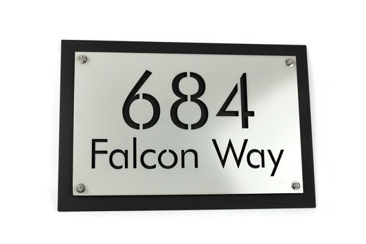 Light gray over black layered metal address sign