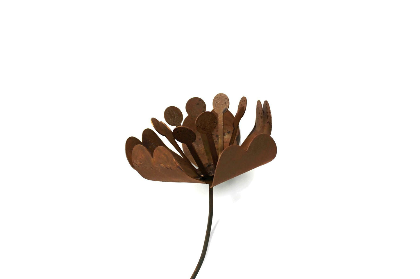 Daffodil and magnolia flower inspired rusty metal garden stake