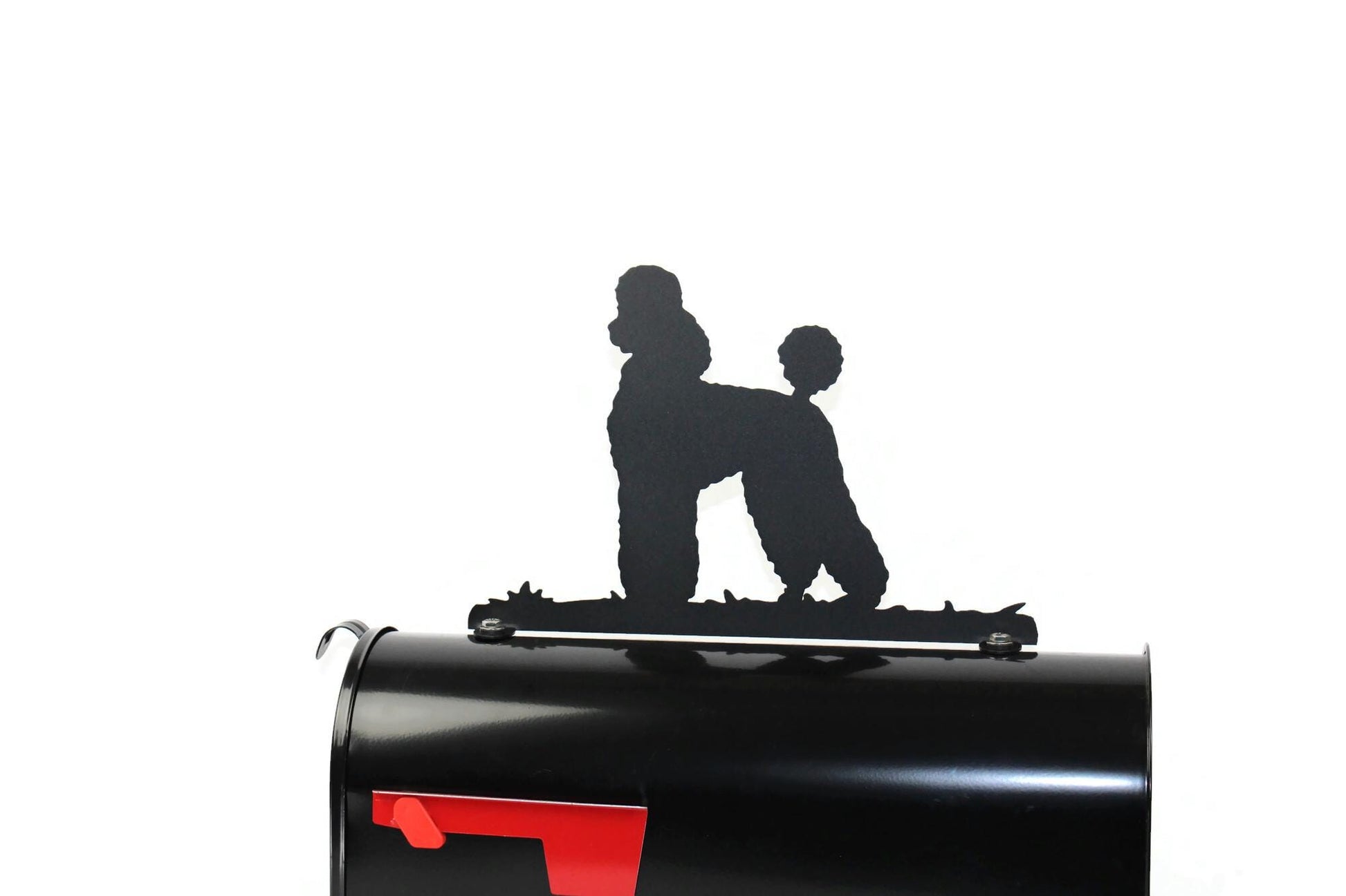 Black poodle mailbox topper installed on a mailbox