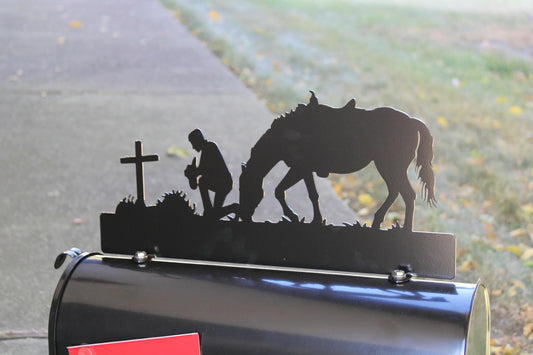 Black praying cowboy with horse custom mailbox topper installed on a mailbox