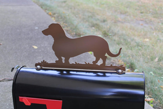 Brown dachshund mailbox topper installed on a mailbox