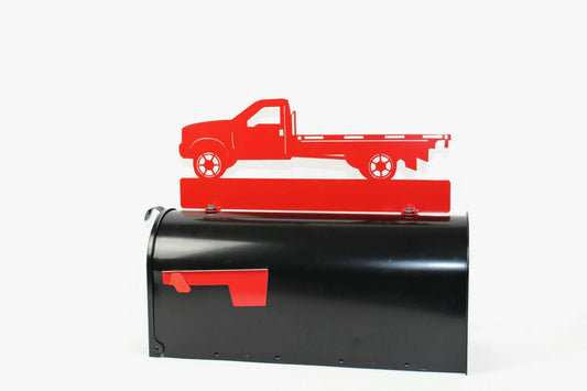 Red flatbed truck mailbox topper installed on a mailbox.