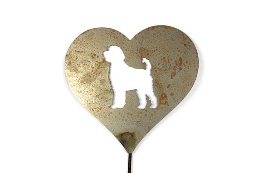 Heart-shaped rusty garden stake sign in rust with a labradoodle dog silhouette