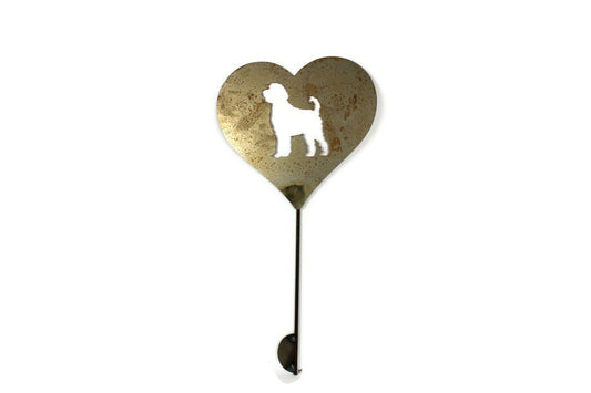 Heart-shaped rusty garden stake sign in rust with a labradoodle dog silhouette