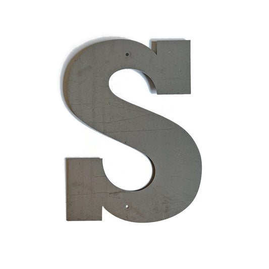 Metal letter S in raw steel