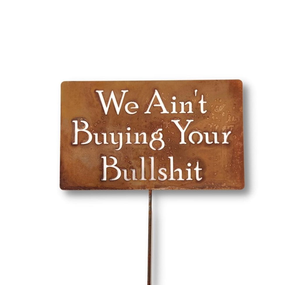 We Ain't Buying Your Bullshit rusty garden stake sign
